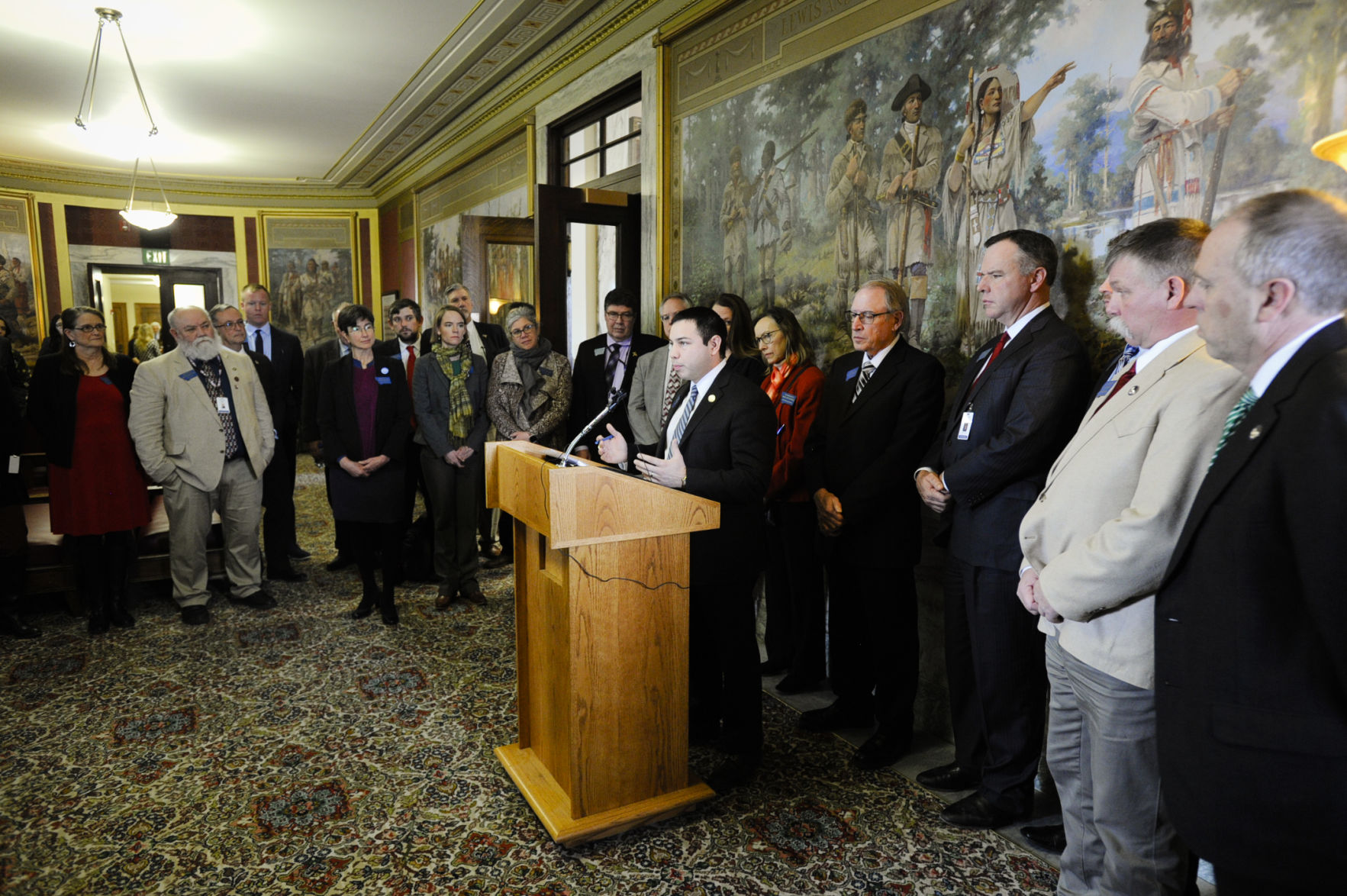 Rep. Shane Morigeau(D-Missoula) speaks alongside a group of republican and democrat lawmakers
